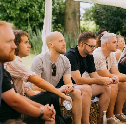 Zengenti team members sat down under a marquee